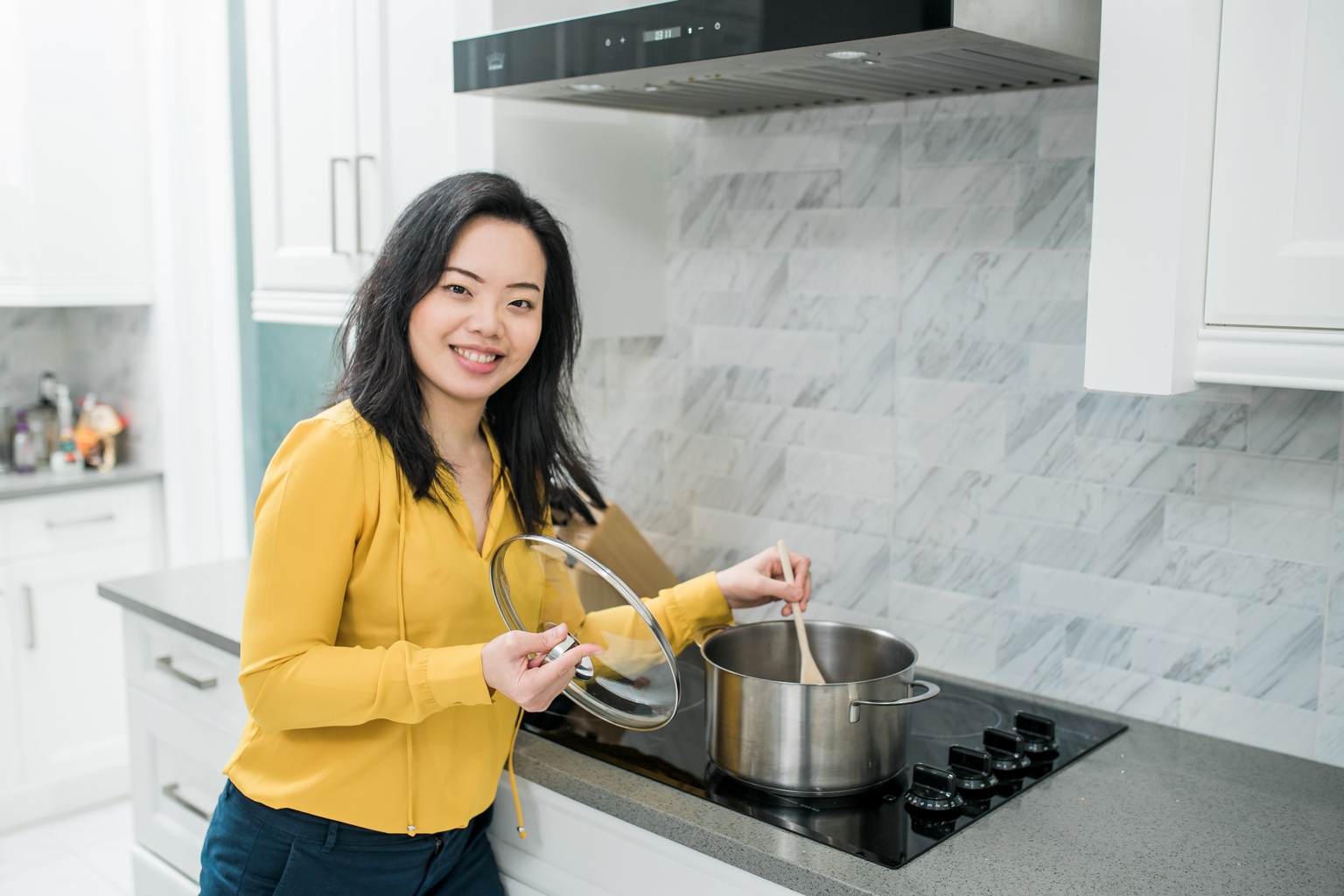 Jessica preparing food in a bright kitchen
