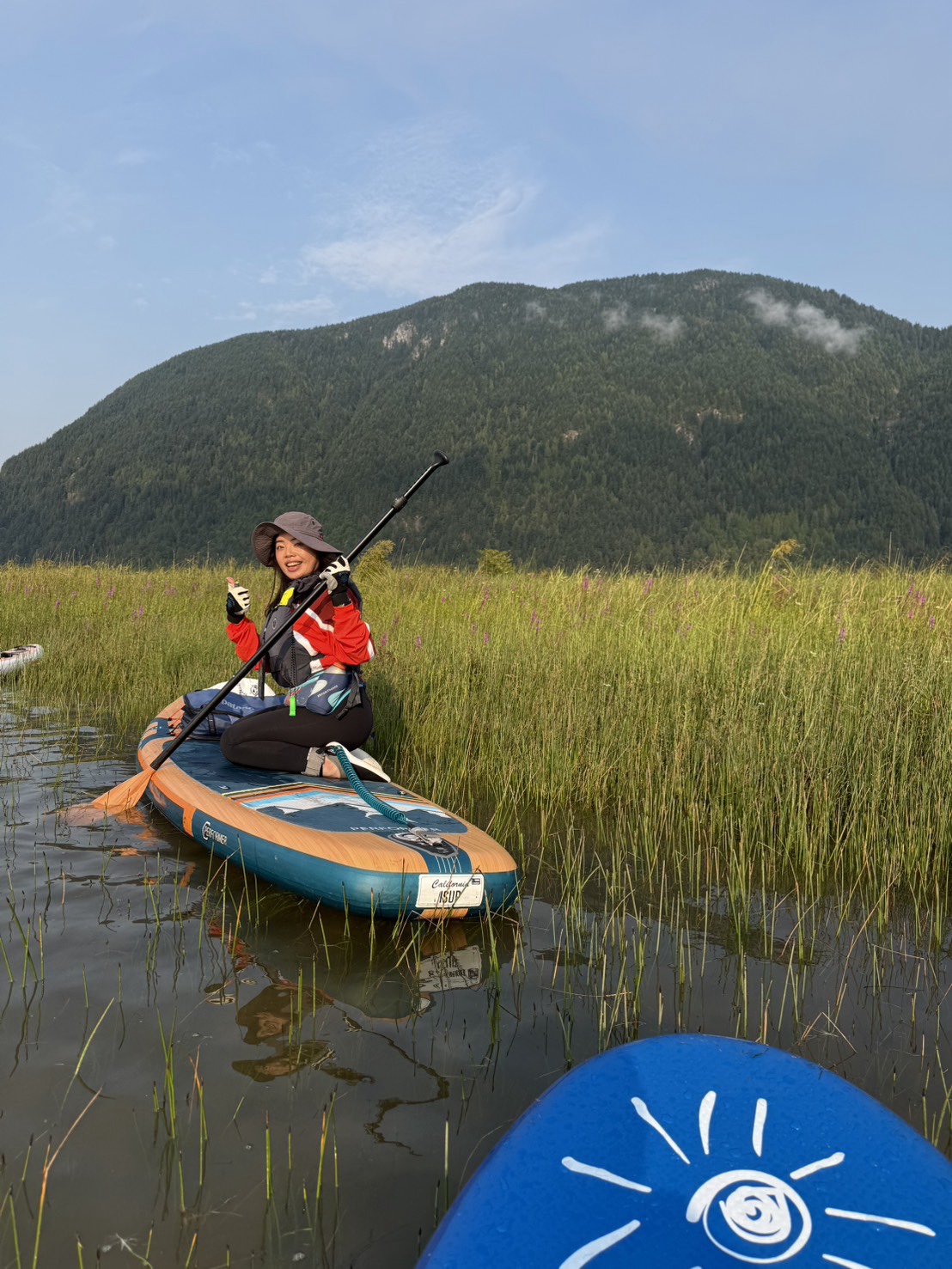 Jessica smiling while paddleboarding in British Columbia